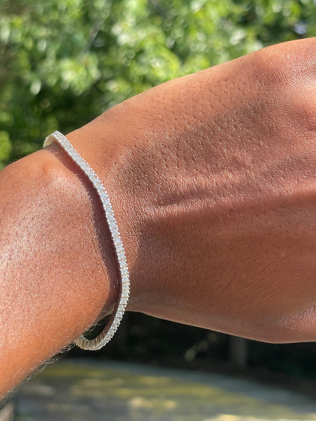 Diamond tennis bracelet worn on the wrist by Statement92