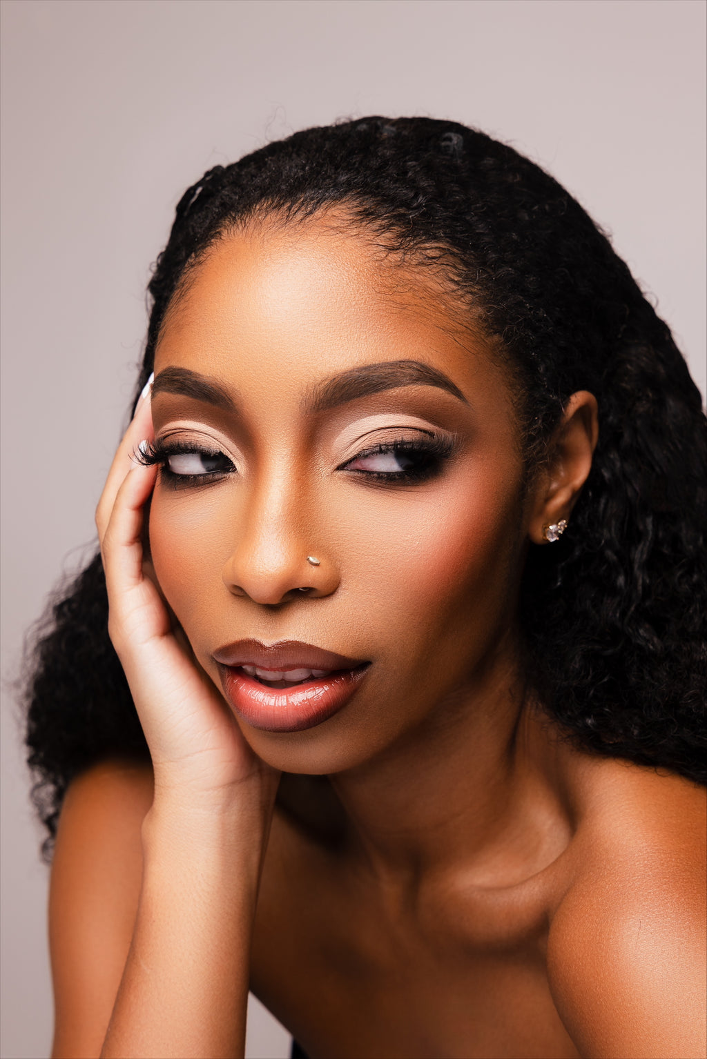 Everyday diamond stud earrings worn in a portrait by Statement92